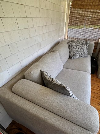 Plymouth MA vacation rental - Side enclosed porch with relaxing lounge space and dining area
