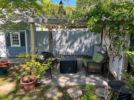 South Yarmouth Cape Cod vacation rental - Pergola with lights and fire pit
