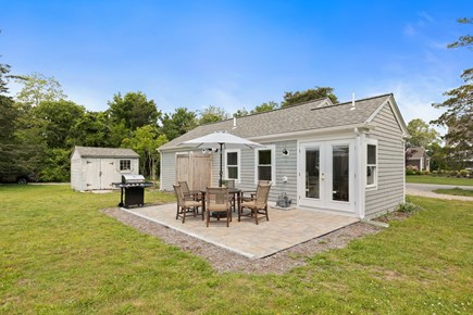 Pocasset Cape Cod vacation rental - Spacious backyard with patio, outdoor shower, grill and table