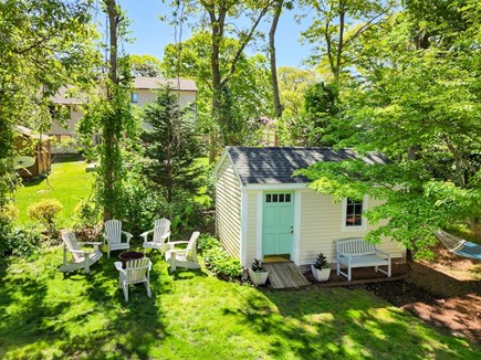 Falmouth Cape Cod vacation rental - View of firepit and yard from back deck