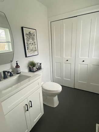 Barnstable, East Falmouth Cape Cod vacation rental - Half bath first floor with laundry behind the doors