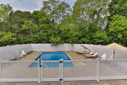 Eastham Cape Cod vacation rental - Outdoor heated pool with ample sunbathing furniture!