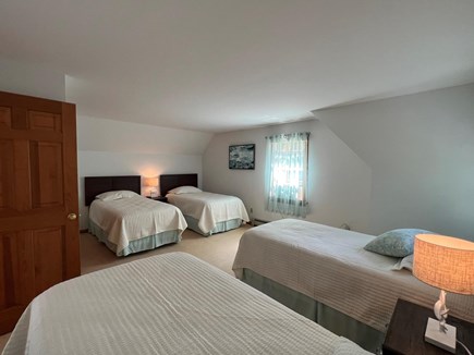 Chatham Cape Cod vacation rental - East 2nd floor Bedroom showing 4 twin beds with a/c unit