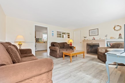 West Dennis Cape Cod vacation rental - Living room with couches and access to 3rd bedroom