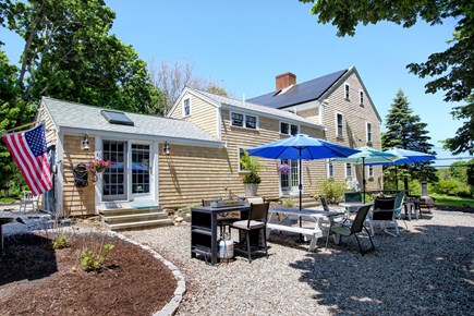 Barnstable Cape Cod vacation rental - Behind the Captains Quarters is the east patio