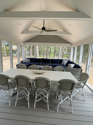 Herring Pond Area - Eastham Cape Cod vacation rental - Oversized screened porch for dining and lounging.
