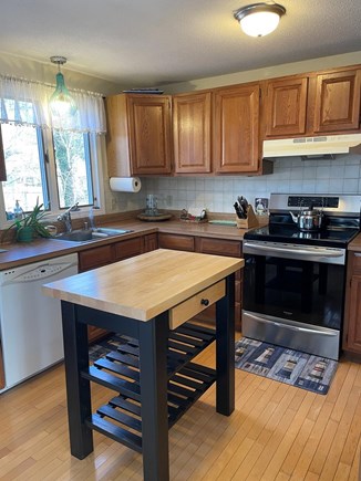 Harwich Cape Cod vacation rental - Full kitchen with induction range dishwasher and small island.