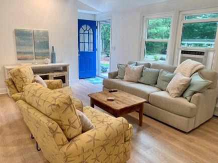 Brewster Cape Cod vacation rental - Living room open to kitchen and dining.