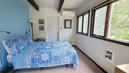 Wellfleet Cape Cod vacation rental - First floor bedroom with queen bed and slider to front deck