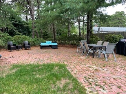 Yarmouth Cape Cod vacation rental - Outdoor dining table, seating, gas and charcoal grill and games