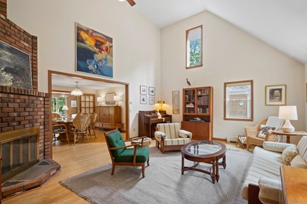South Dennis Cape Cod vacation rental - The living room boasts impressive vaulted ceilings and art work