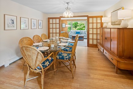 South Dennis Cape Cod vacation rental - The dining rooms seats eight and is connected to the sun room