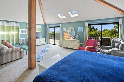 Wellfleet Cape Cod vacation rental - Primary bedroom with glimpses of Cape Cod Bay, private lounging