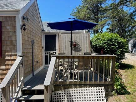 Truro, Whitman House Cottages Cape Cod vacation rental - Side Deck with Table, Chairs and the Outdoor shower