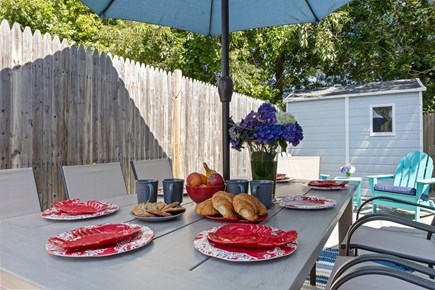 Dennisport Cape Cod vacation rental - Outdoor seating/dining for 8 plus adirondacks
