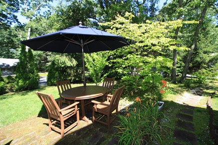 South Dennis Cape Cod vacation rental - Enjoy the patio table in the side yard