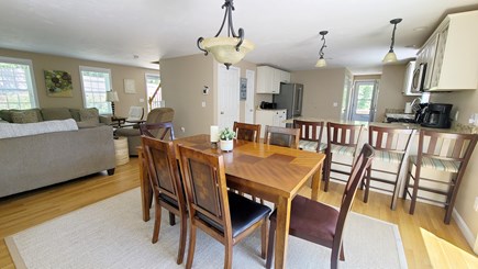Wellfleet Cape Cod vacation rental - Dining area with living room and kitchen beyond