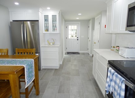 Harwich Port Cape Cod vacation rental - Kitchen leads to entrance first floor bath