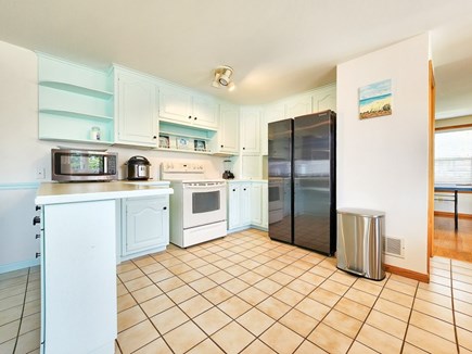 Dennis Cape Cod vacation rental - Additional view of kitchen with fridge, oven, and microwave