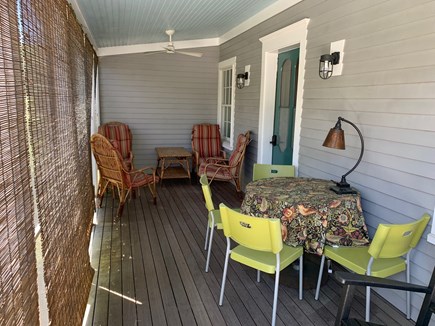 Wellfleet Center Cape Cod vacation rental - Screened in front porch seats 9 overlooks Commercial St. scene