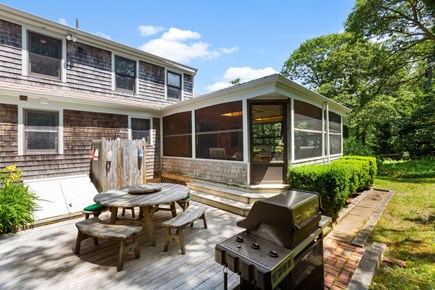 Chatham Cape Cod vacation rental - Back patio with grill, table and outdoor shower