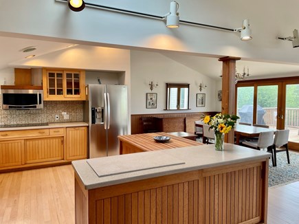 Wellfleet Cape Cod vacation rental - Well-equipped kitchen, open layout. Dining area opens onto deck.