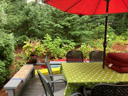 New Seabury Cape Cod vacation rental - Back deck with dining table.