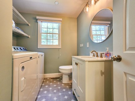 Falmouth Cape Cod vacation rental - Main-level shared bathroom with laundry facilities