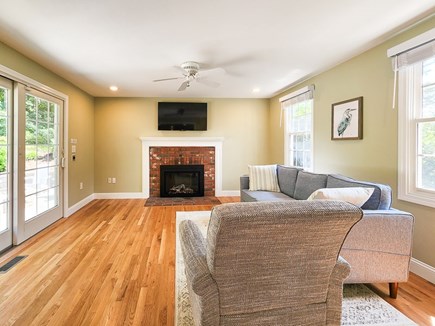 Falmouth Cape Cod vacation rental - Family room with additional seating, smart TV, firelpace