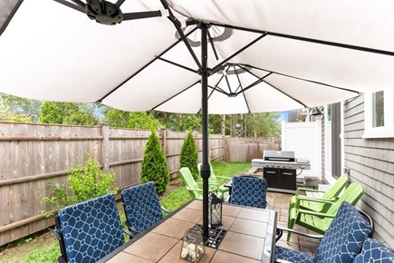 Falmouth Cape Cod vacation rental - Fenced backyard with outside shower, patio, and grill