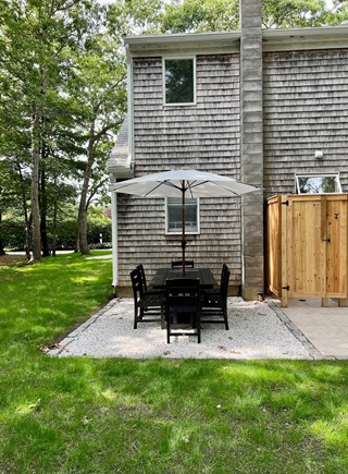 East Falmouth Cape Cod vacation rental - Outdoor dining, outdoor shower, gas grill, hammock, fire pit.