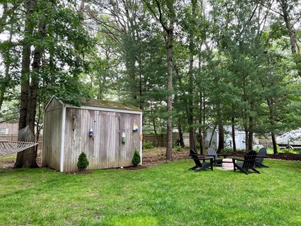East Falmouth Cape Cod vacation rental - Hammock, fire pit, outdoor dining, gas grill and outdoor shower.