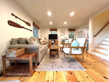 East Falmouth Cape Cod vacation rental - Living room with an expandable dining table, books and games!