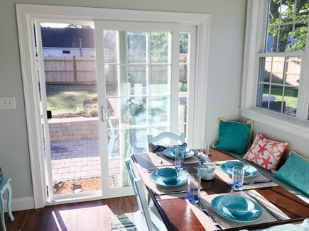 South Yarmouth Cape Cod vacation rental - Sunny dining room with direct access to the patio and grill.