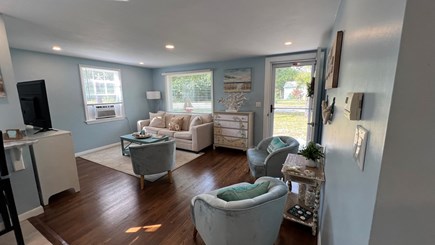 East Falmouth Cape Cod vacation rental - Living room and seating area,A/C window & new 50in TV