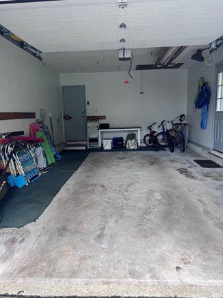 East Falmouth Cape Cod vacation rental - One car garage w/ bikes, beach chairs/ gear. Enters to kitchen