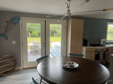 Orleans Cape Cod vacation rental - Dining with Double Doors to Patio, Fenced in Backyard and Pool