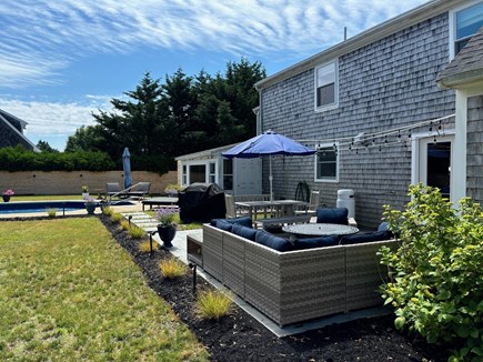 Orleans Cape Cod vacation rental - Backyard Patio with Outdoor Seating, Grill and View to Pool Area