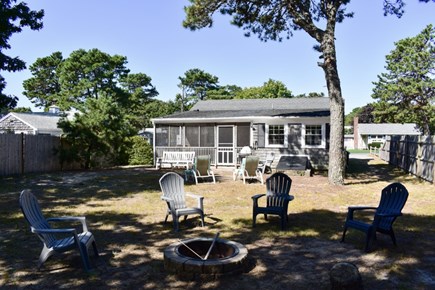 Dennis Port Cape Cod vacation rental - Spacious backyard with firepit