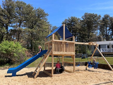 Truro Cape Cod vacation rental - Fun new cedar swing set and sand box in community area.