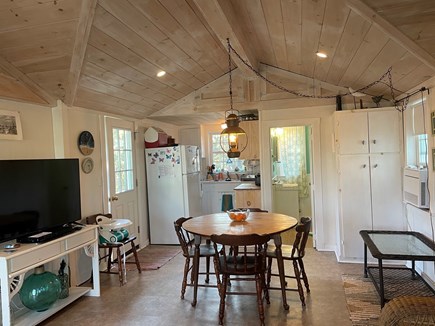Truro Cape Cod vacation rental - Main room with porch door:kitchen to left, bath to right in back.