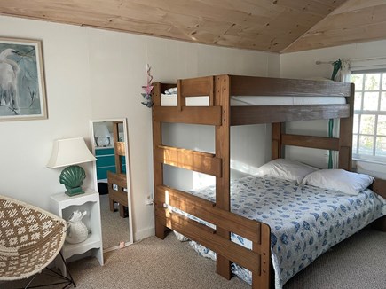 Truro Cape Cod vacation rental - Second bedroom bunk beds: view facing patio area.