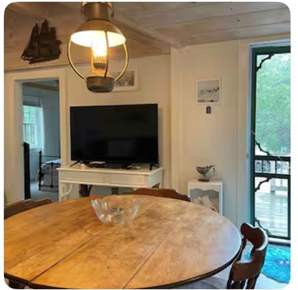 Truro Cape Cod vacation rental - Dining area open to living area and porch. Table expands to fit 6