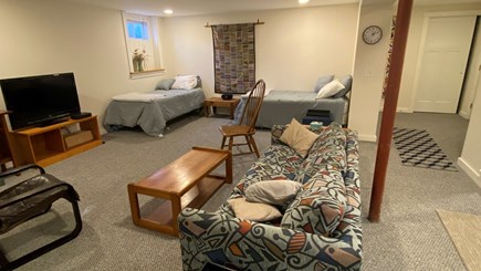 Wellfleet Cape Cod vacation rental - FInished basement with TV, games, art table and additional beds.