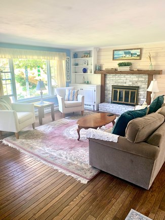 Brewster Cape Cod vacation rental - Open living room with fireplace and TV