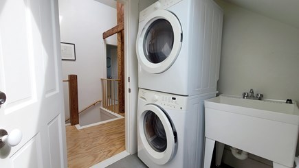Wellfleet Cape Cod vacation rental - Third floor laundry room with stacked washer/dryer and sink