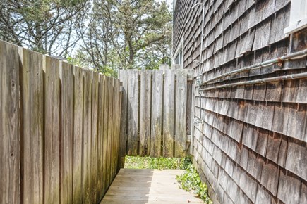 Truro Cape Cod vacation rental - An outdoor shower looking out into the forested back yard