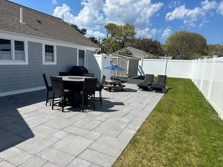 South Yarmouth Cape Cod vacation rental - Dining table with firepit and outdoor shower