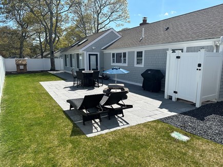 South Yarmouth Cape Cod vacation rental - Fully fenced in backyard with bluestone pavers