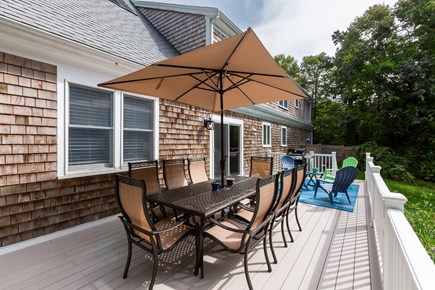 Brewster Cape Cod vacation rental - Seating for eight beneath the shade of the oversized umbrella